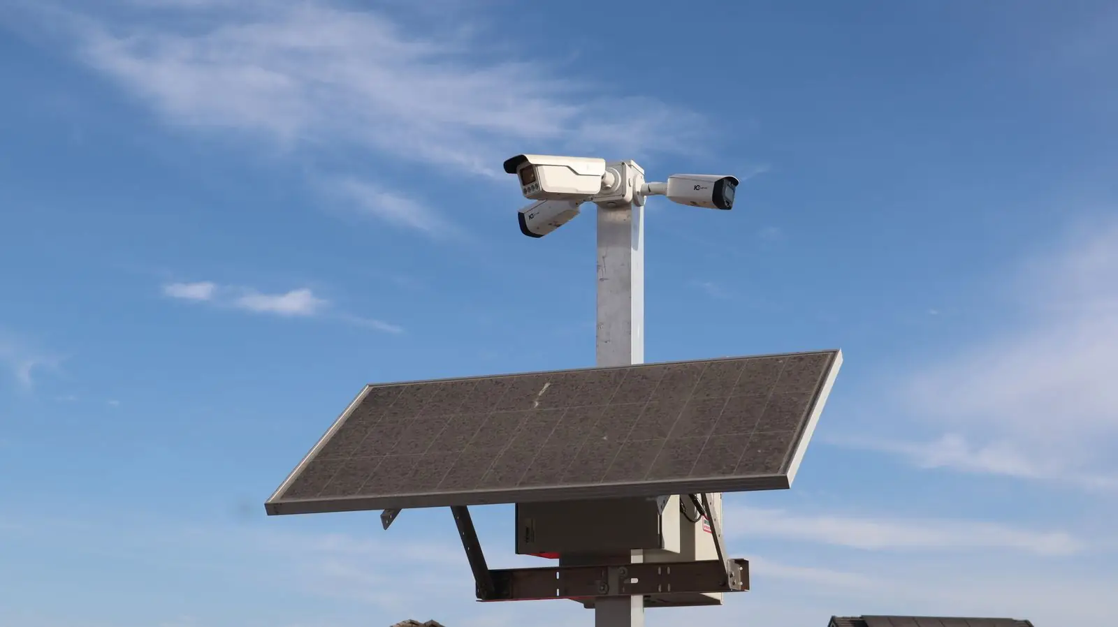 Security camera mounted on a pole outdoors